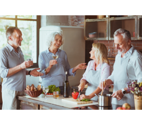 Adults in kitchen socializing